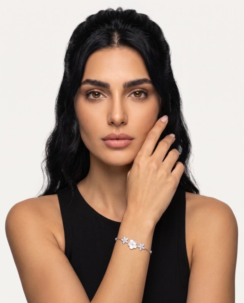 Model wearing Heart and Star Charm Bracelet in silver