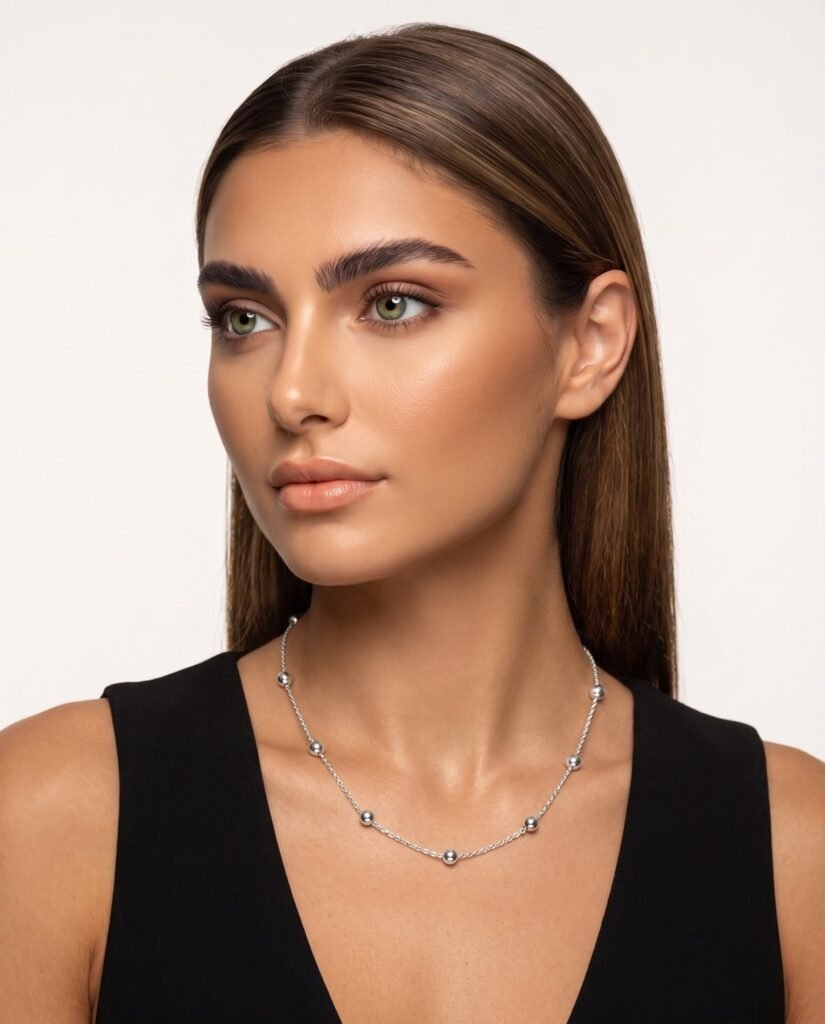 Model wearing Delicate Charm Necklace in silver