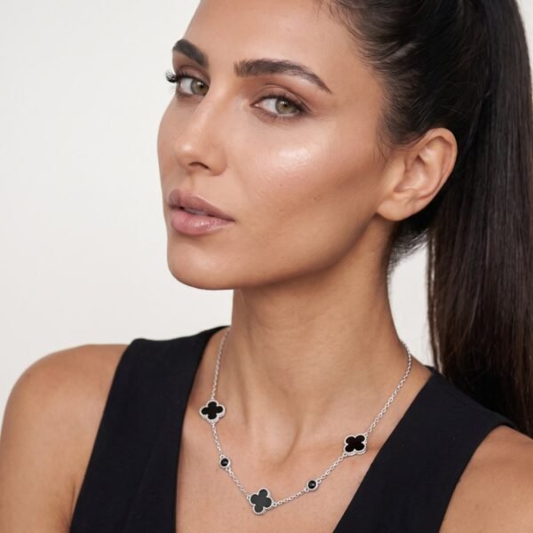Model wearing Onyx Clover Necklace in silver
