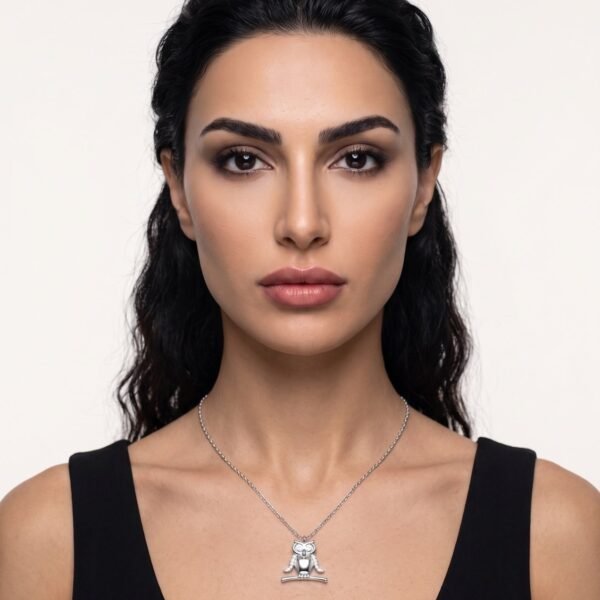 Model wearing Owl Necklace in silver