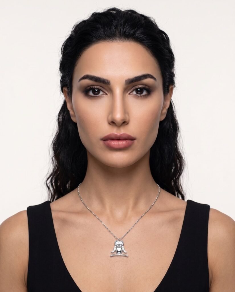 Model wearing Owl Necklace in silver