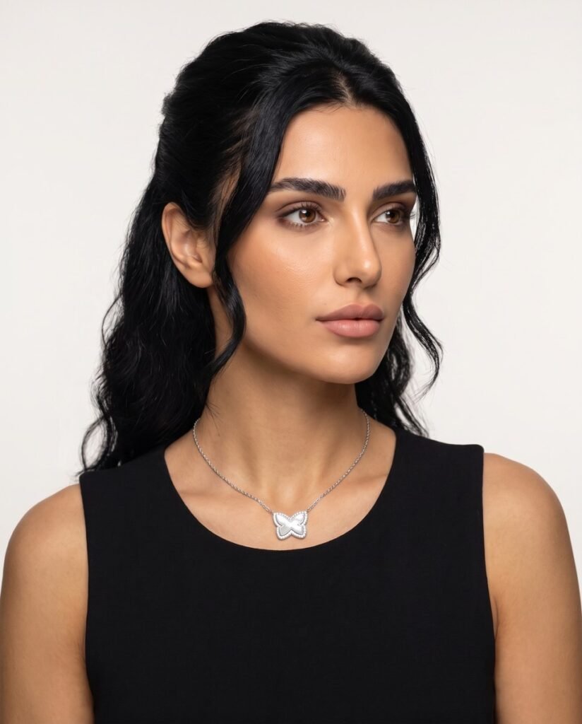Model wearing Sparkle Butterfly Necklace in silver
